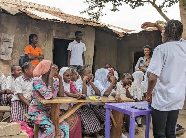 Woman teaching primary school children